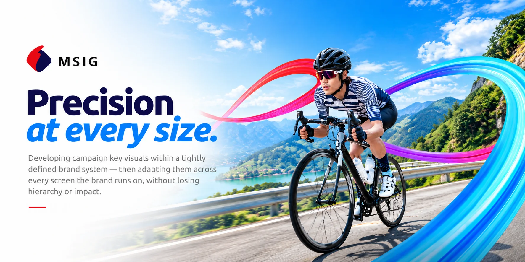 MSIG &mdash; Precision at every size. Developing campaign key visuals within a tightly defined brand system &mdash; then adapting them across every screen the brand runs on, without losing hierarchy or impact. A road cyclist on a mountain highway, with a sweeping ribbon of red, pink and blue curving through the frame.